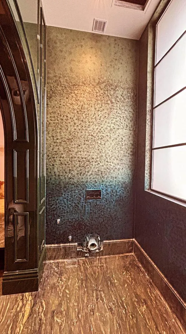 Ombré metallic wall finish fading from gold to deep blue